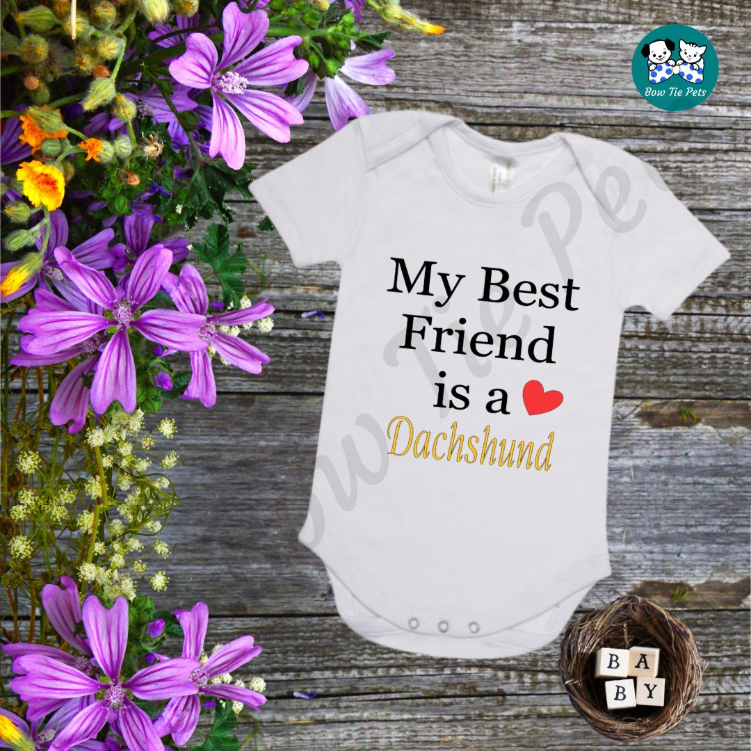 "My best friend is a Dachshund" White romper, black and gold writing with a red heart. 